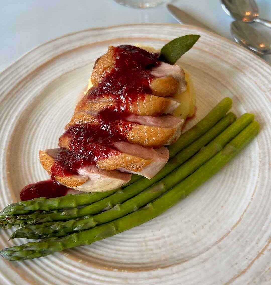 Pan seared duck breast with a fresh blackberry sage sauce paired with a Washington Riesling