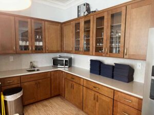 Community Center Renovation update – server station cabinets with glassware and menus