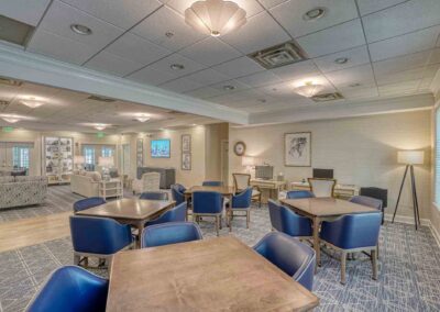 londonderry community center lounge seating with tables chairs, computers and tv
