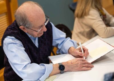 londonderry resident writing at the clubhouse