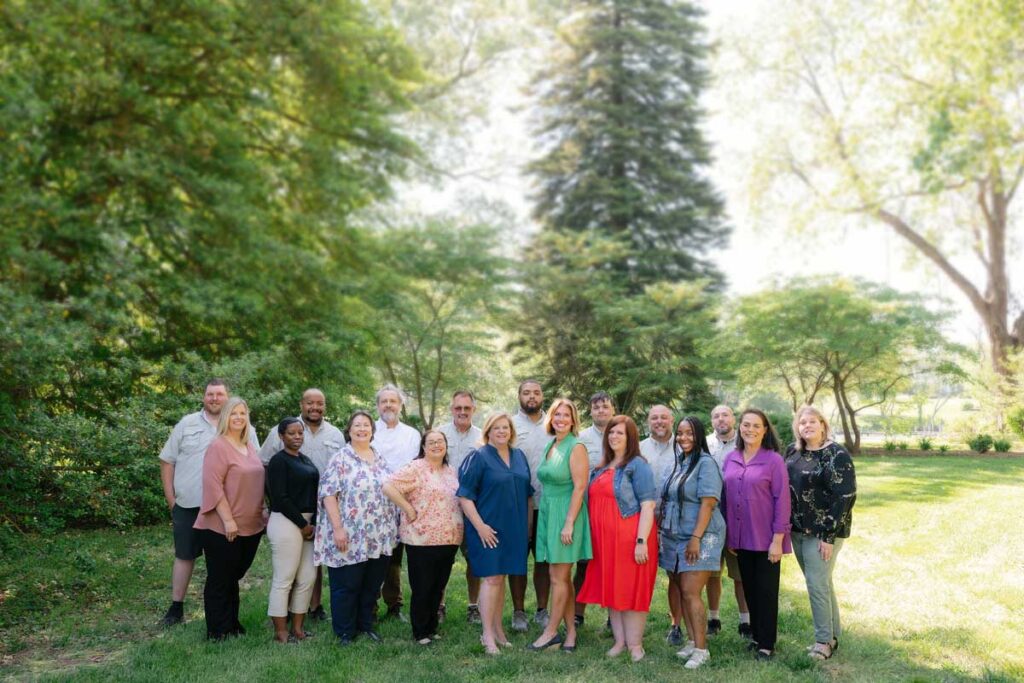 2026 best residential community– Londonderry team on campus grounds next to Tred Avon River.